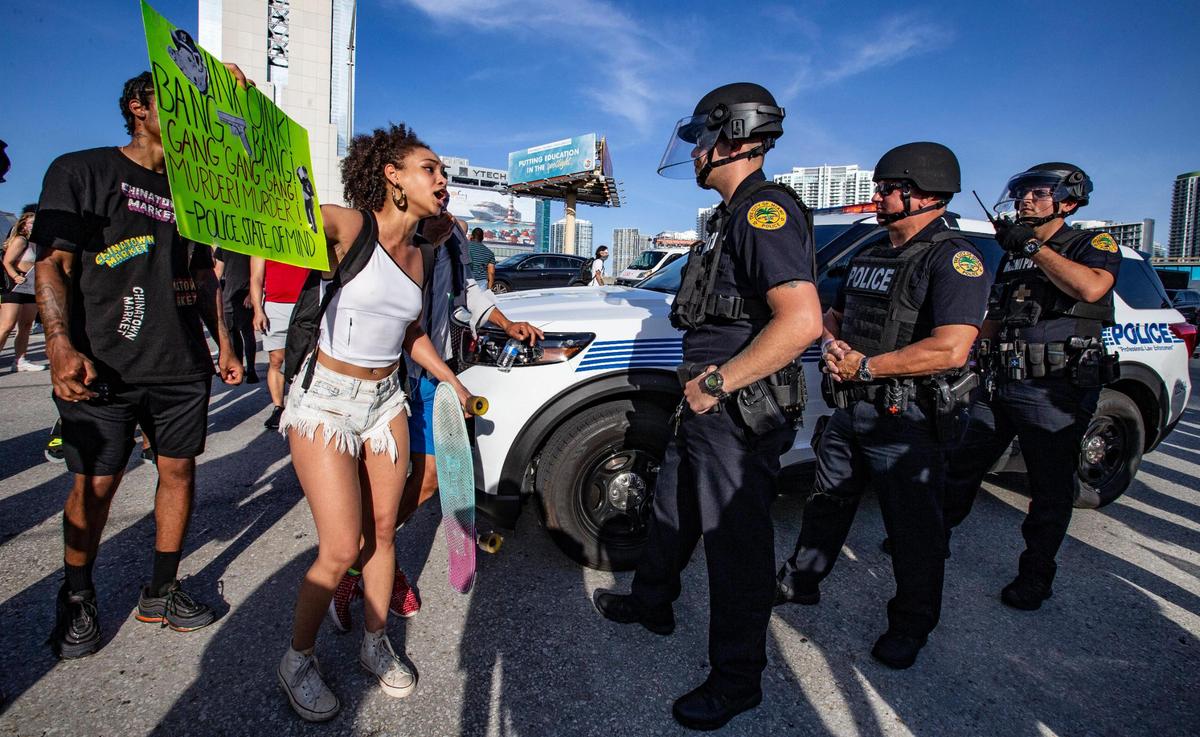 Activists confront city of Miami police on Interstate 95 during a George Floyd protest in downtown Miami on Saturday, May 30, 2020.