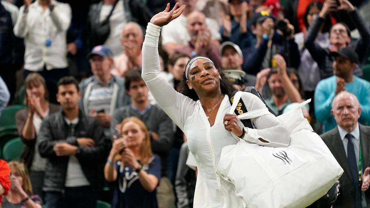 Serena Williams of the US waves as she leaves the court after losing to France’s Harmony Tan in a first round women’s singles match on day two of the Wimbledon tennis championships in London, Tuesday, June 28, 2022. (AP Photo/Alberto Pezzali)