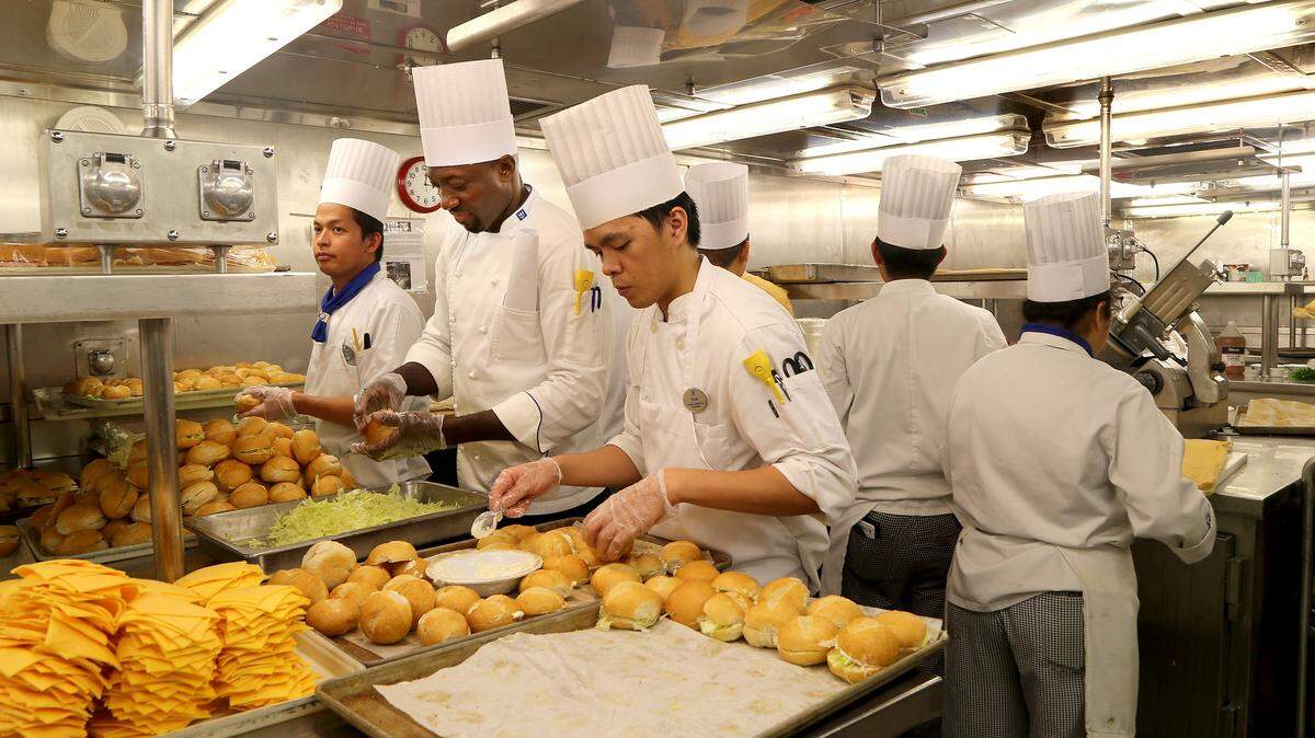 Staff members of the food and beverages division aboard of the Royal Caribbean ship Empress of the Seas, prepare sandwiches to be packed on containers with meals during the night on the ship’s way to Freeport Bahamas. Royal Caribbean is setting up a center on Grand Bahamas Island to deliver 10.000 meals daily and to offer different services to support the victims after the destructive path of Hurricane Dorian across the Bahamas, on Wednesday September 05, 2019.