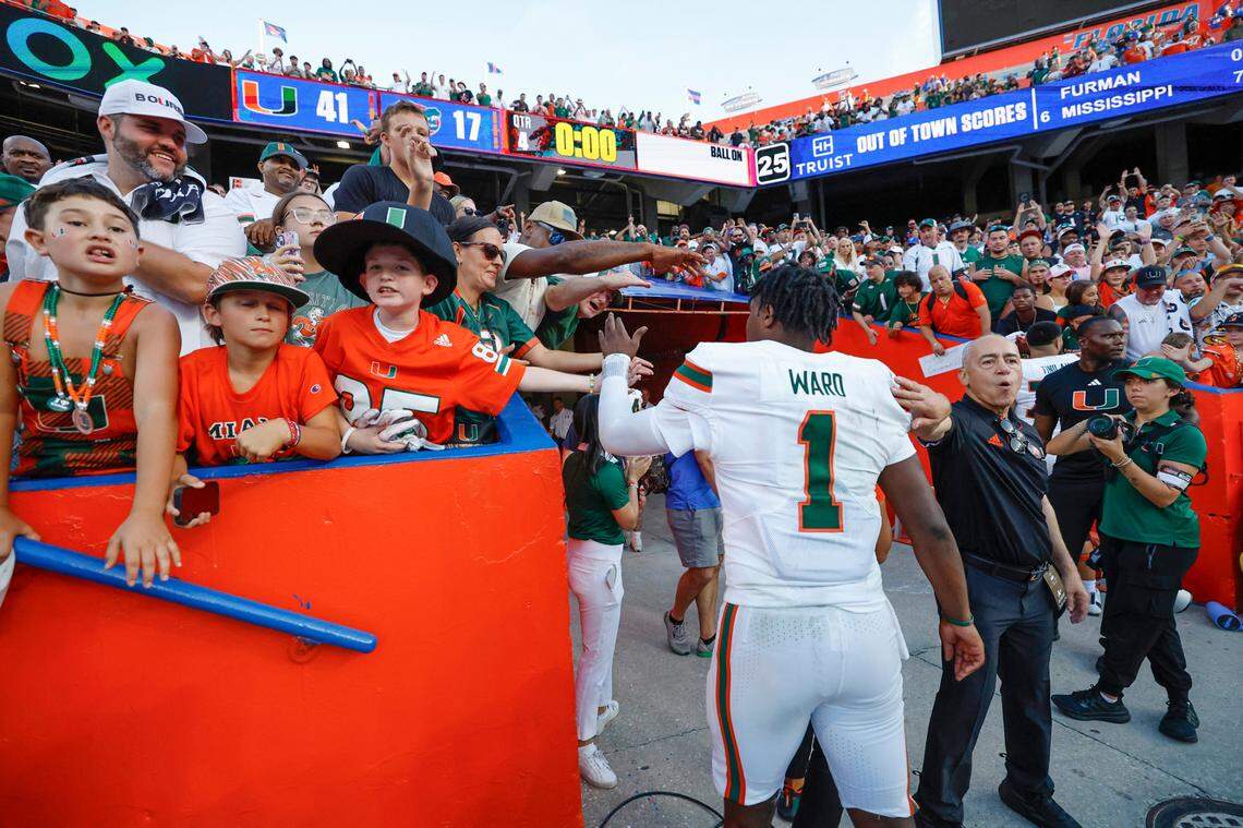 Miami Hurricanes quarterback Cam Ward (1) celebrates with fans after the Canes defeat the Florida Gators in an NCAA college football game at Ben Hill Griffin Stadium in Gainesville, Florida, on Saturday, August 31, 2024.