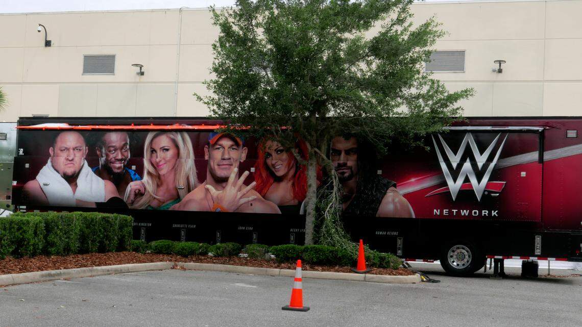 A trailer set up near a satellite truck to transmit wrestling broadcasts is parked outside the WWE Performance Center Tuesday, April 14, 2020, in Orlando, Fla.