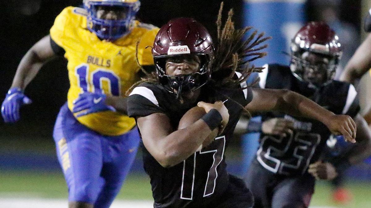 Norland Vikings quarterback Ennio Yapoor (17) carries the ball against Northwestern Bulls during their football game on Friday, September 13, 2024 at Traz Powell Stadium in Miami.