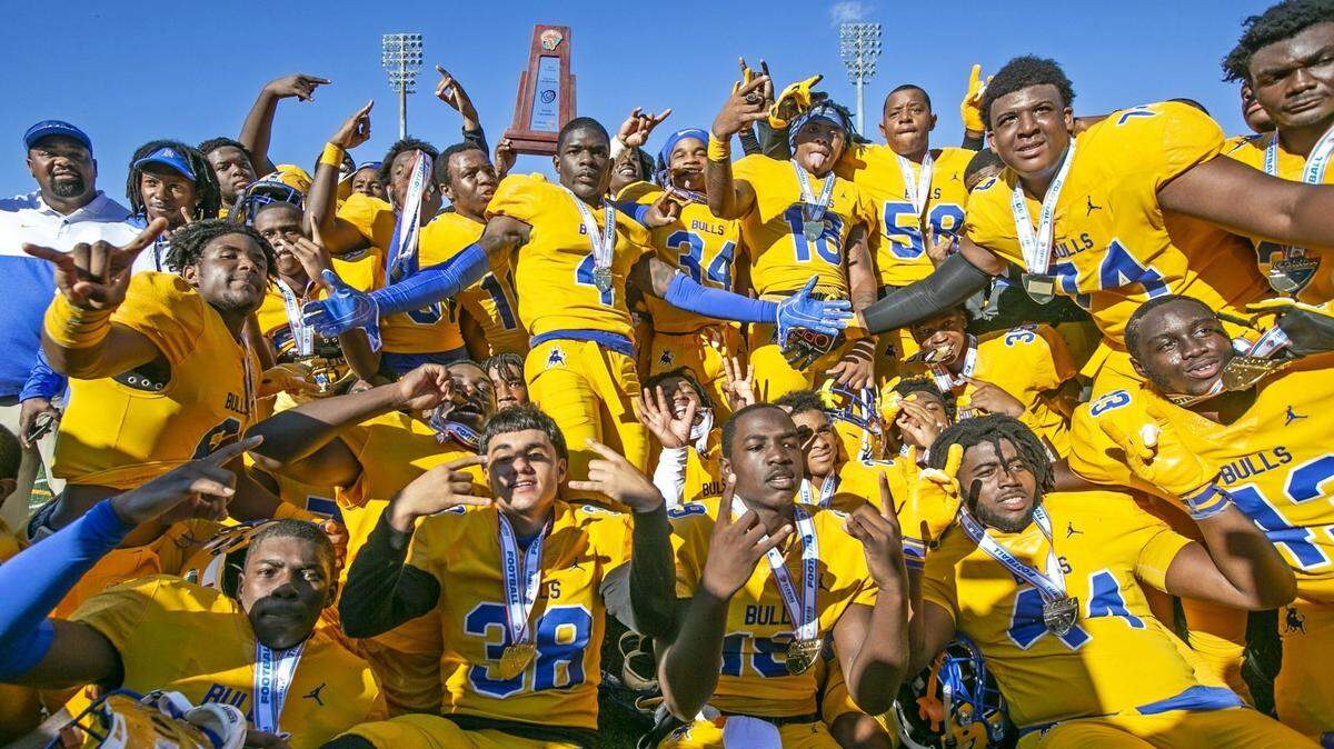 The Bulls celebrate after Miami Northwestern defeats the Jones Fightin Tigers 34-17 for the Class 5A FHSAA State Championship at Daytona Stadium in Daytona Beach on Saturday, December 14, 2019.