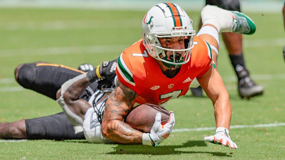 Miami Hurricanes wide receiver Xavier Restrepo (7) earns a first down against Southern Miss Golden Eagles in the first quarter at Hard Rock Stadium in Miami Gardens on Saturday, September 10, 2022.