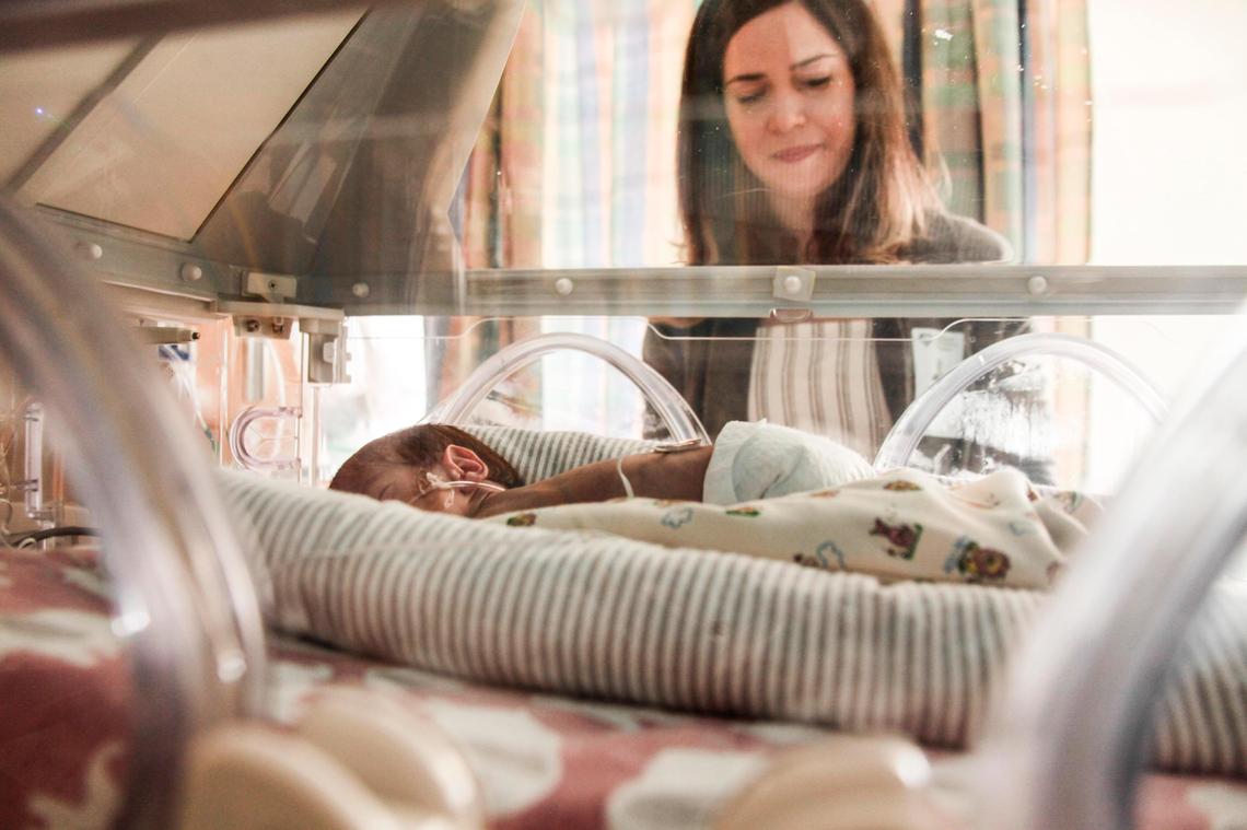 Sagri checks on Diana, one of her quadruplet daughters at Nicklaus Children’s Hospital on July 12. Nicklaus opened a 10-bed Fetal Care Center’s Special Delivery Unit in June for mothers of high-risk infants.