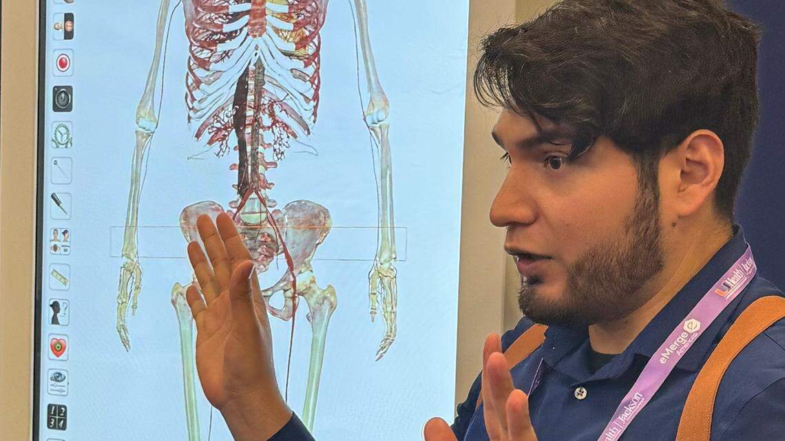 Juan Melo of Miami Dade College explains how the 3D virtual dissection table can help students better understand how the human body works during the 10th annual eMerge Americas conference in Miami Beach on April 18, 2024.
