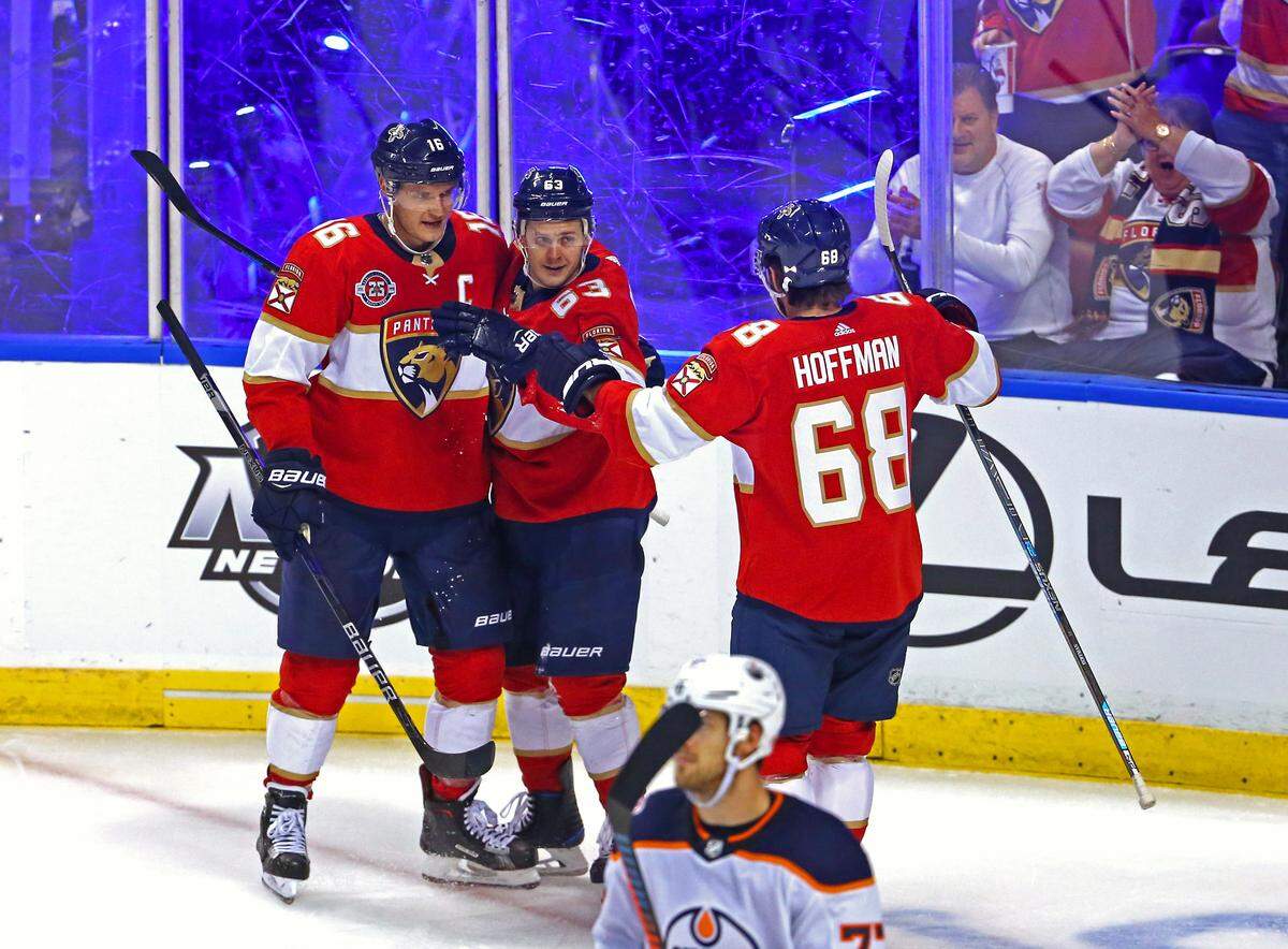 Florida Panthers right wing Evgenii Dadonov (63) celebrates with teammates after scoring a goal against the Edmonton Oilers goalie Cam Talbot (33) during the second period of an NHL regular season hockey game at the BB&T Center on Thursday, November 8, 2018 in Sunrise.