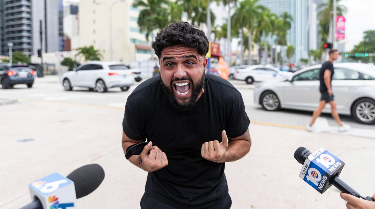 A pro-Israel activist reacts as a group of pro-Palestine activists gather during a rally near the Torch of Friendship on Friday, Oct. 13, 2023, in downtown Miami, Fla.