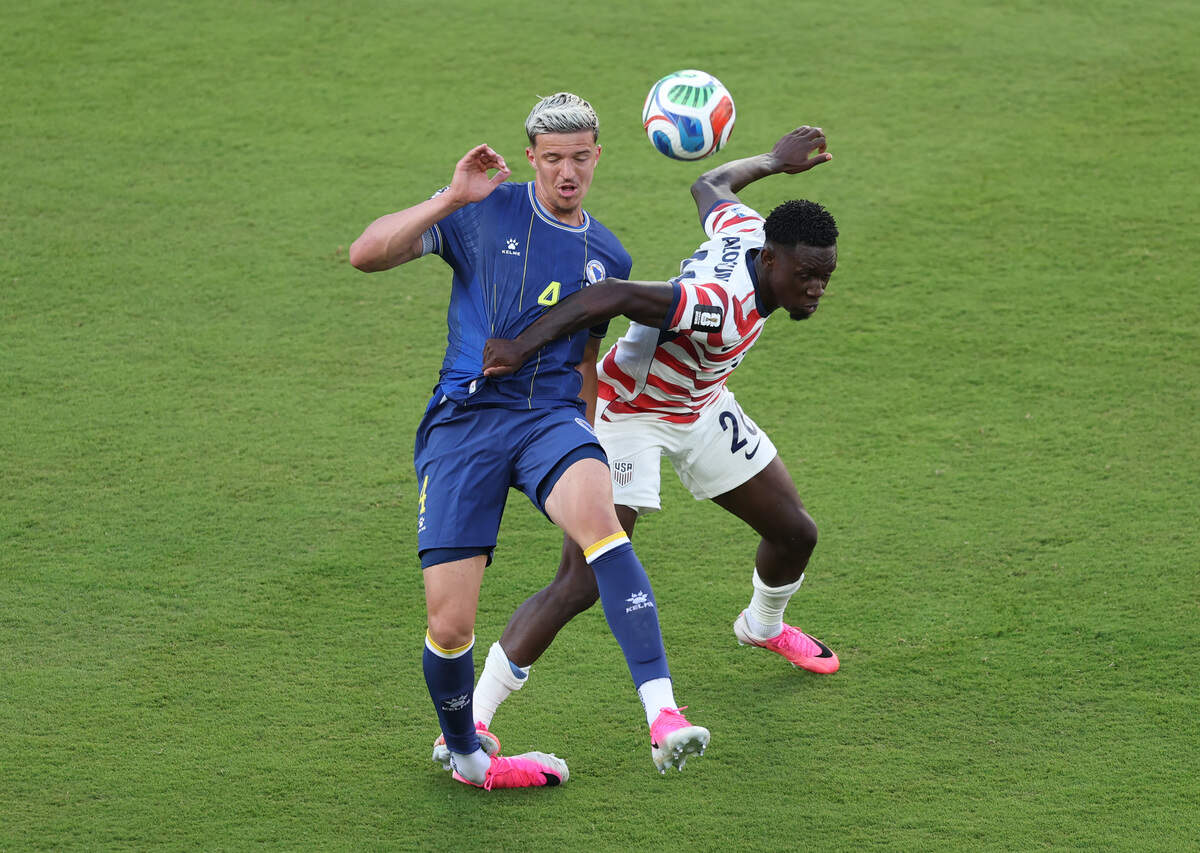 SANTA CLARA, CALIFORNIA - JULY 01: Folarin Balogun #20 of the United States fouls Tarik Muharemovic #4 of Bosnia and Herzegovina which is later reviewed by VAR and awarded as a red card foul a during the FIFA World Cup 2026 Round of 32 match between USA and Bosnia and Herzegovina at San Francisco Bay Area Stadium on July 01, 2026 in Santa Clara, California. (Photo by Michael Steele/Getty Images)