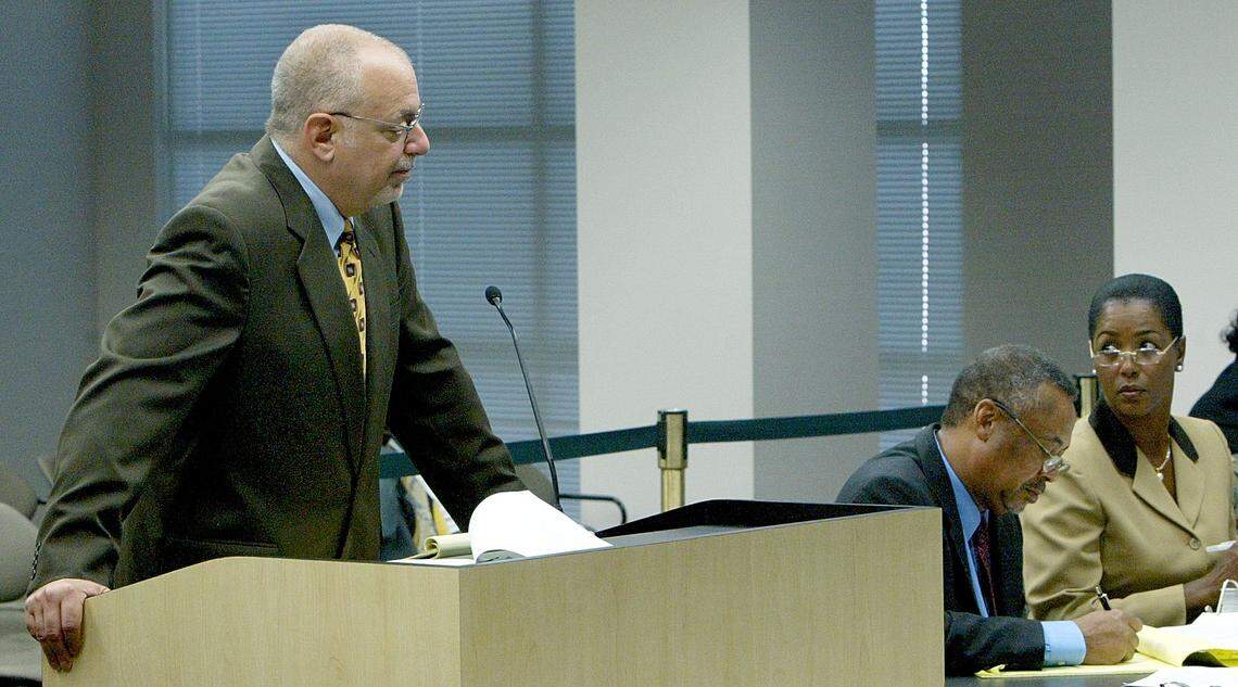 Pete Antonacci, as special counsel for the Governor’s office, left, asks a question of a witness during the Senate hearing of suspended Broward County Supervisor of Elections Miriam Oliphant, right, Monday, July 19, 2004, in Tallahassee, Fla.  Henry Hunter, Oliphant’s attorney is seated center.