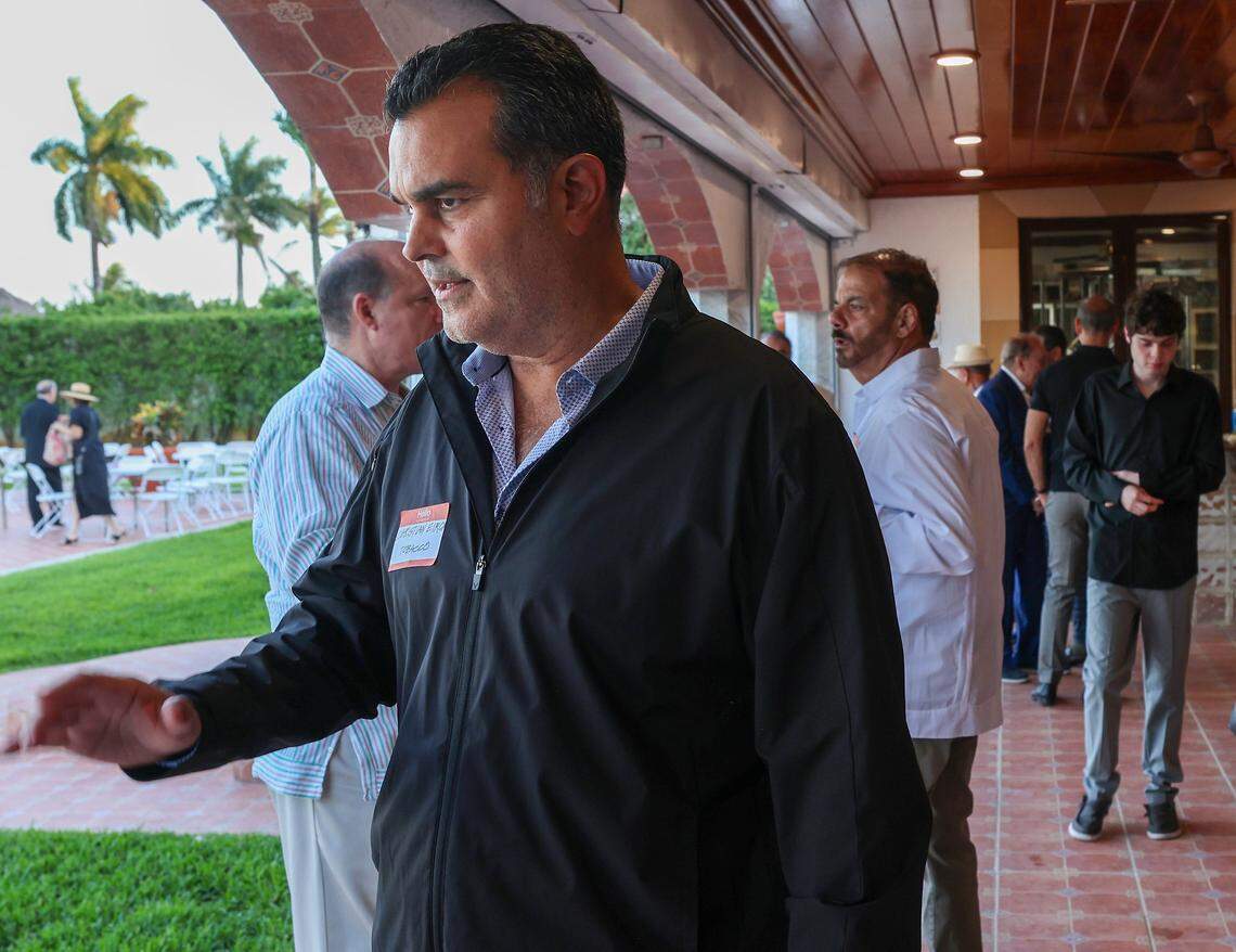 Cigar makers Christian Louis Eiroa, center, mingles with other Cuban and Cuban-American entrepreneurs as they gathered for a private event on Tuesday, March 31, 2026, in Miami, Florida, to organize and pledge to invest in Cuba if there is a change in government.