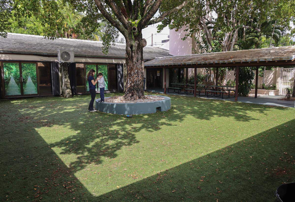 A therapist has one-on-one time with a student inside the former church courtyard of Crystal Academy. The Miami Herald was given tour of the school as it tries to continue to serve the needs of children with autistic students on Monday, September 23, 2025.