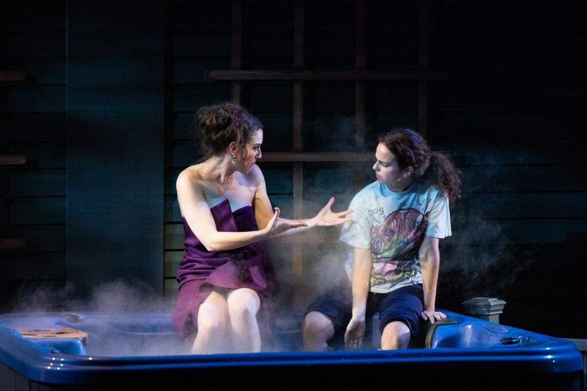 Dani Stoller as Chaya and Arielle Goldman as Izzy on the back porch set with working hot tub in Miami New Drama’s “Birthright.”