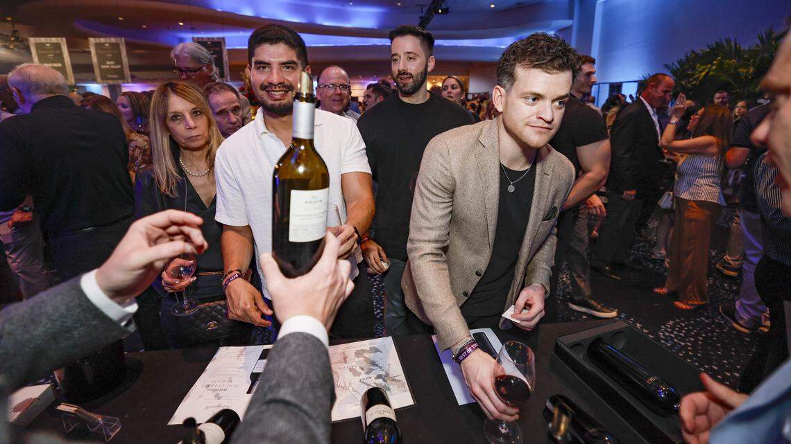 Guests line up for wine being served as the Fontainebleau Miami Beach presents Wine Spectator's Best of the Best with 60 of the nation’s most acclaimed chefs and more than 65 of the world’s premier wineries at the resort hotel on Friday, February 20, 2026.