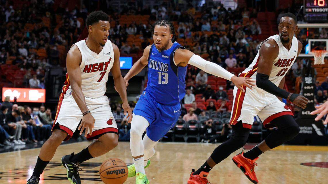 Miami Heat center Bam Adebayo (13) runs as teammate Heat guard Kyle Lowry (7) drives against Dallas Mavericks guard Jalen Brunson (13) during the first quarter of their NBA basketball game at the FTX Arena on Tuesday, February 15, 2022 in Miami, Fl.