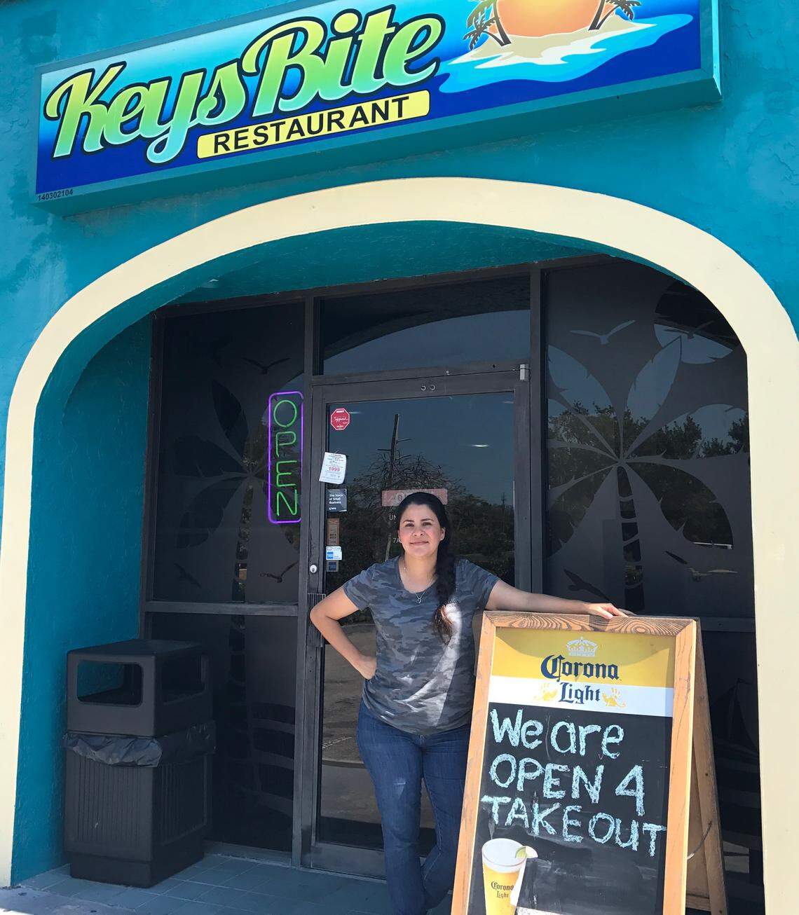 Adela Munoz, owner of Keys Bite in Key Largo, stands in front of her business Friday, March 27, 2020. The restaurant is only open for takeout.