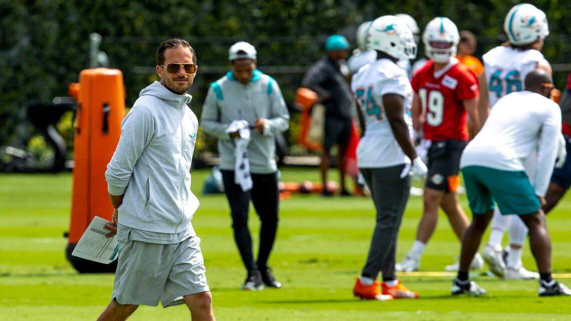 Miami Dolphins Head coach Mike McDaniel walks across the practice field during the second day of mandatory mini camp at Baptist Health Training Complex in Miami Gardens, Florida, on Thursday, June 2, 2022.