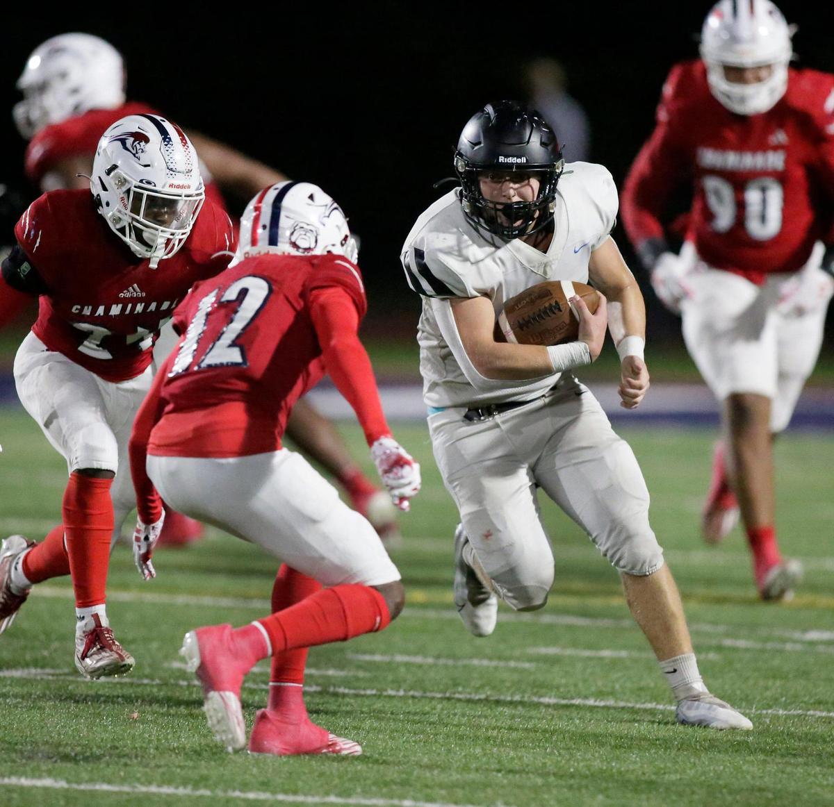 Archbishop Carroll Bulldogs Sylus Villanueva runs the ball against Chaminade-Madonna Lions during the state semifinal football game on Friday, December 1, 2023 at Chaminade-Madonna School in Hollywood. Andrew Uloza / for Miami Herald