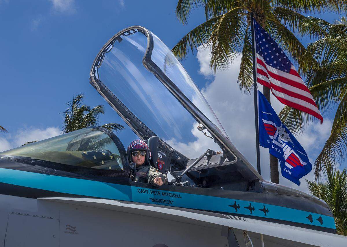 Saint Alvarez, 10, sits inside the replica cockpit of Canadian Air Force Col. Dewey ‘JellyFish’ Larson’s F/A-18 Hornet in South Beach on display during the Hyundai Air & Sea Show in Miami Beac, on Saturday, May 23, 2026. 