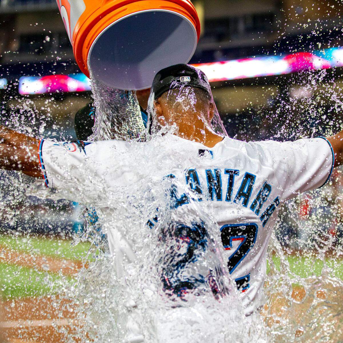 Miami Marlins pitcher Pablo Lopez (49) pours water over Sandy Alcantara (22) after the Marlins defeated the Cincinnati Reds 3-0 in nine innings of an MLB game at loanDepot park in the Little Havana neighborhood of Miami, Florida, on Wednesday, August 3, 2022.