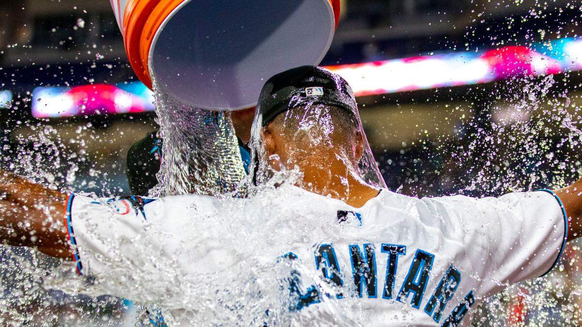 Miami Marlins pitcher Pablo Lopez (49) pours water over Sandy Alcantara (22) after the Marlins defeated the Cincinnati Reds 3-0 in nine innings of an MLB game at loanDepot park in the Little Havana neighborhood of Miami, Florida, on Wednesday, August 3, 2022.
