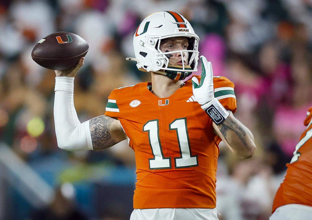 Miami Hurricanes quarterback Carson Beck (11) sets up to pass in the second half of their NCAA football game at Hard Rock Stadium in Miami Gardens, Florida, on Friday, October 17, 2025.