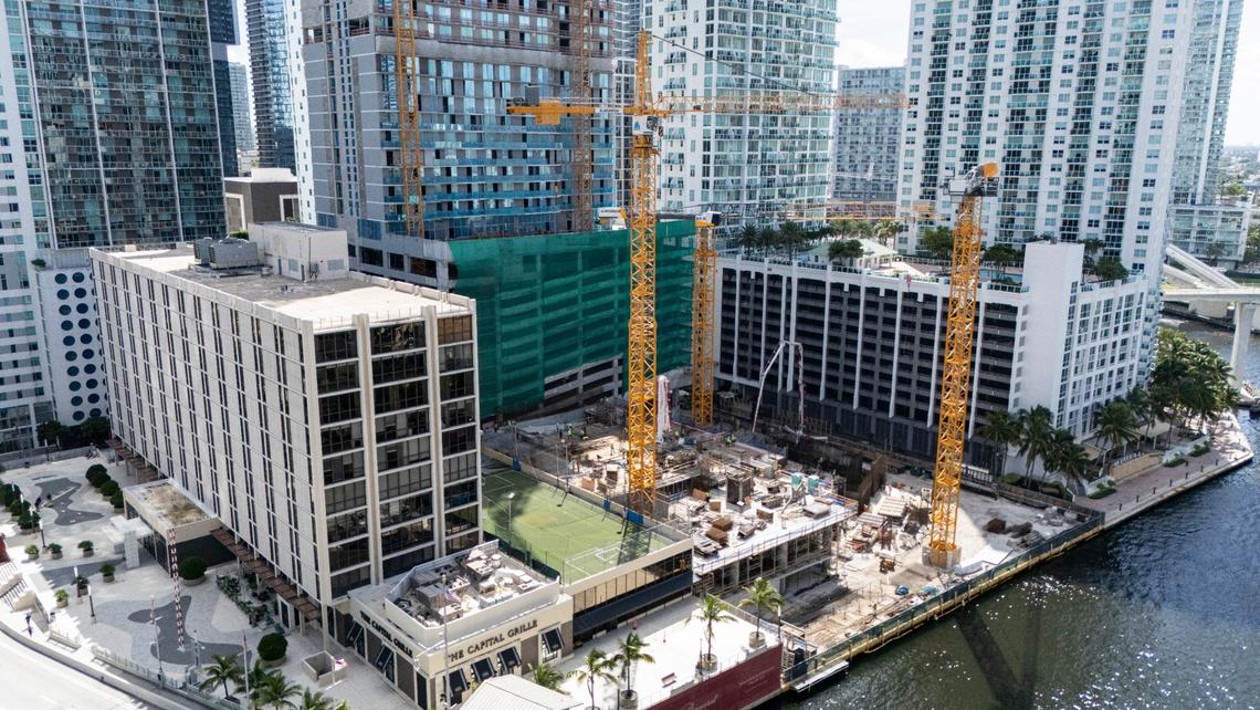 An aerial view taken in September 2024 shows two residential towers under construction by Related Group on the Miami River site where archaeologists unearthed remnants of a 3,000-year-old indigenous village. Construction began after extensive archaeological excavations concluded. Excavated materials are being stored at the 444 Brickell building, at left, which is slated for a third tower that won’t be built until that site is also excavated starting around 2028.