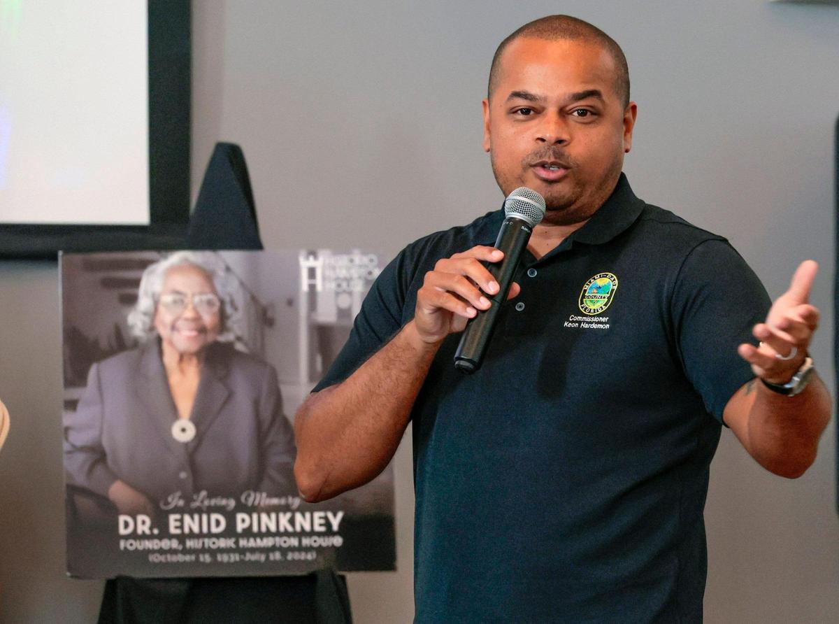 Miami Dade County Commissioner Keon Hardemon speaks during the street naming ceremony for Dr. Enid Curtis-Pinkney.