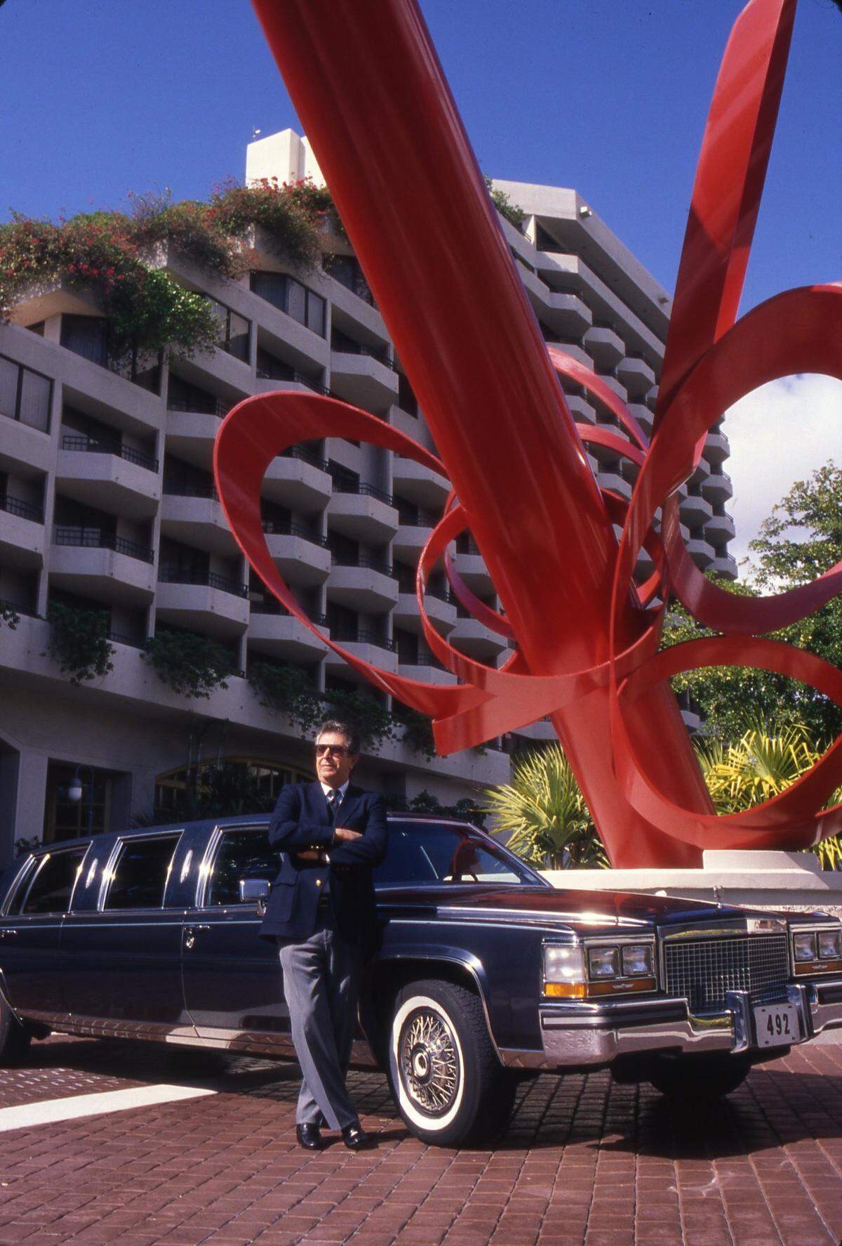 In this file photo from Jan. 19, 1989, driver Juan Fajardo stood ready outside of the original Grand Bay Hotel in Coconut Grove to transport dignitaries who stayed there or partied upstairs at Régine’s disco.