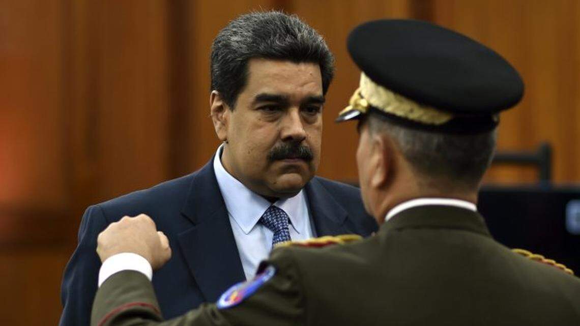In 2018, Venezuela’s Nicolas Maduro speaks with defense minister Vladimir Padrino at the Miraflores presidential palace in Caracas, Venezuela.