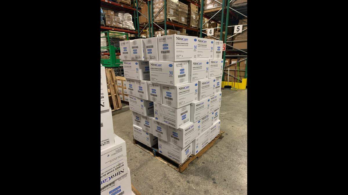 Two men were arrested Monday afternoon in connection to a theft of about $1 million worth of medical gloves from a Coral Springs warehouse last week, police said.