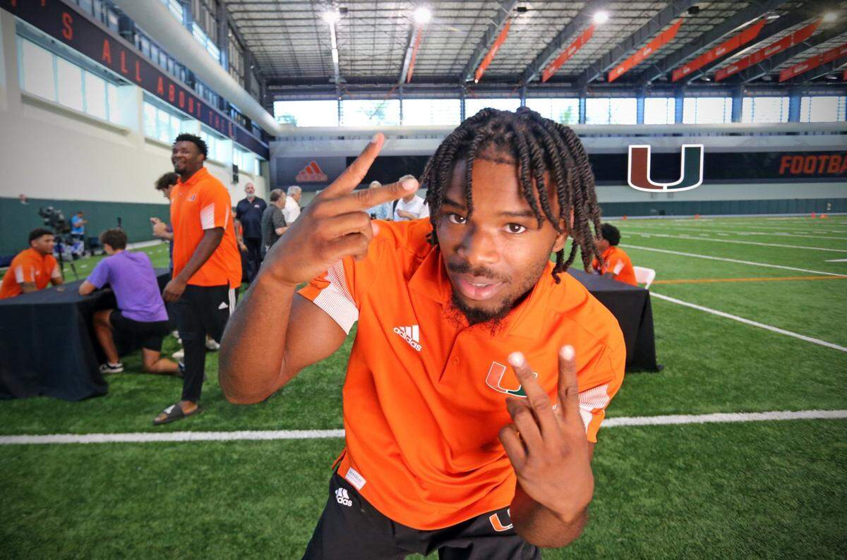 Miami Hurricanes cornerback Al Blades, Jr. (7) reacts to being photographed during Media Day in the Carol Soffer Indoor Practice Facility at the University of Miami on Tuesday, August 2, 2022.