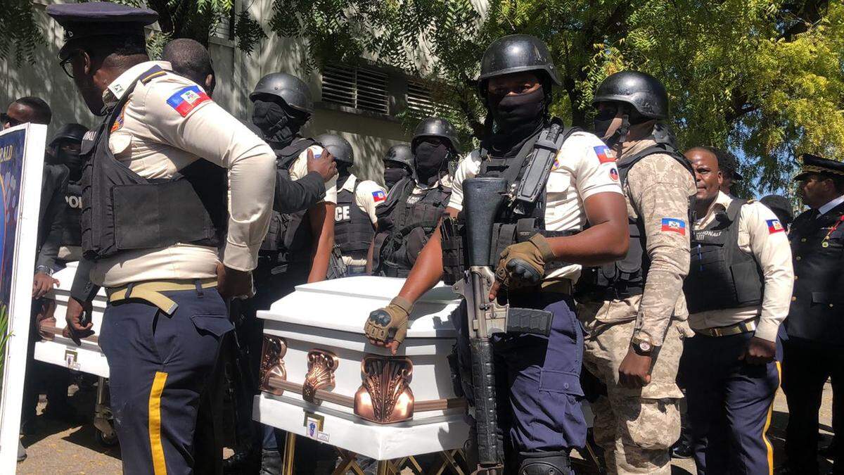 Members of the Haiti National Police bid farewell Tuesday, Jan. 31, 2023, to three of their colleagues in an emotional funeral service at the National Police Academy in Port-au-Prince. The fallen police officers were Luc Eliezer, Duckens Céjuste and Gérald Occinal. A fourth police officer, Ricken Staniclasse, is also presumed to be dead and his body burned by gang members. The cops were killed on Friday, Jan. 20, 2023, in a gang ambush.