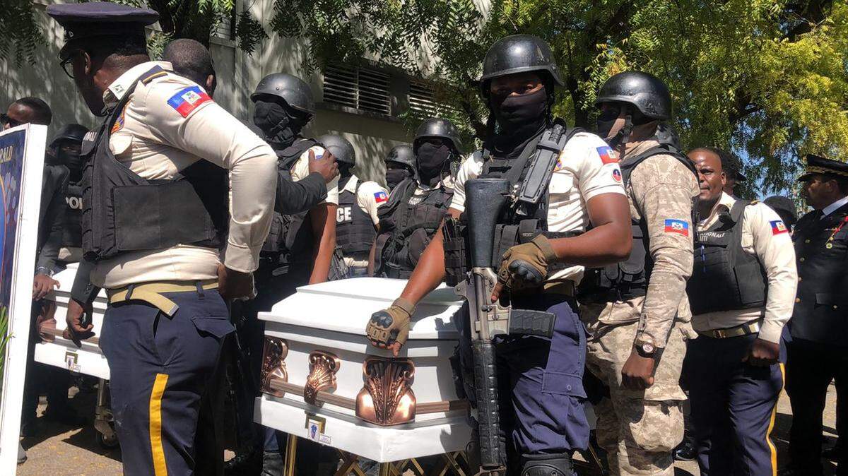 Members of the Haiti National Police bid farewell Tuesday, Jan. 31, 2023, to three of their colleagues in an emotional funeral service at the National Police Academy in Port-au-Prince. The fallen police officers were Luc Eliezer, Duckens Céjuste and Gérald Occinal. A fourth police officer, Ricken Staniclasse, is also presumed to be dead and his body burned by gang members. The cops were killed on Friday, Jan. 20, 2023 in a gang ambush.