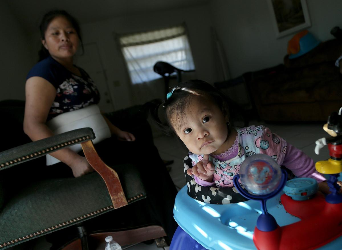 Catarina Gomez and 11-month-old daughter Ruth at home in Florida City on Tuesday, November 26, 2019.