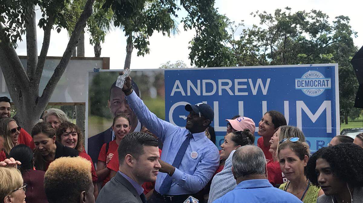 Andrew Gillum takes selfies with supporters outside his Broward County campaign office Friday, Sept. 21, 2018.