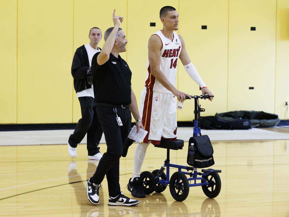 Tyler Herro (14) uses his scooter during the Miami Heat Media Day on Sept. 29, 2025, at Kaseya Center in Miami.