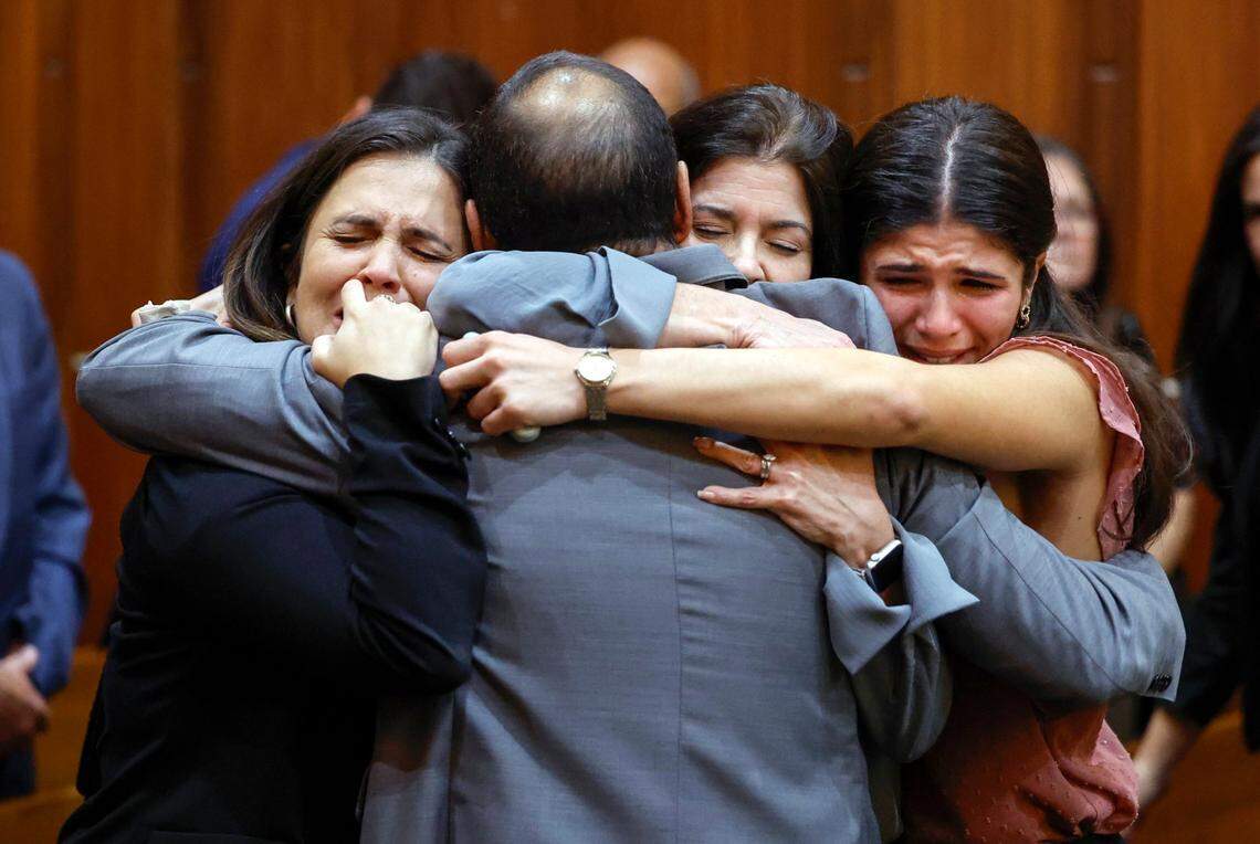 Suspended Miami-Dade Commissioner Joe Martinez hugs his family members as they react to the guilty verdict by the jury in Judge de la O’s courtroom on Thursday, November 7, 2024. Martinez, a former police officer, was convicted of accepting $15,000 in exchange for helping with legislation that would have benefited a constituent.