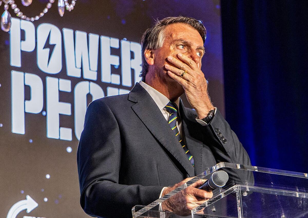 Brazil’s ex-president Jair Bolsonaro reacts as he speaks during his first stateside public appearance at an event hosted by the conservative group, Turning Point USA, at the Trump National Doral resort in Doral.