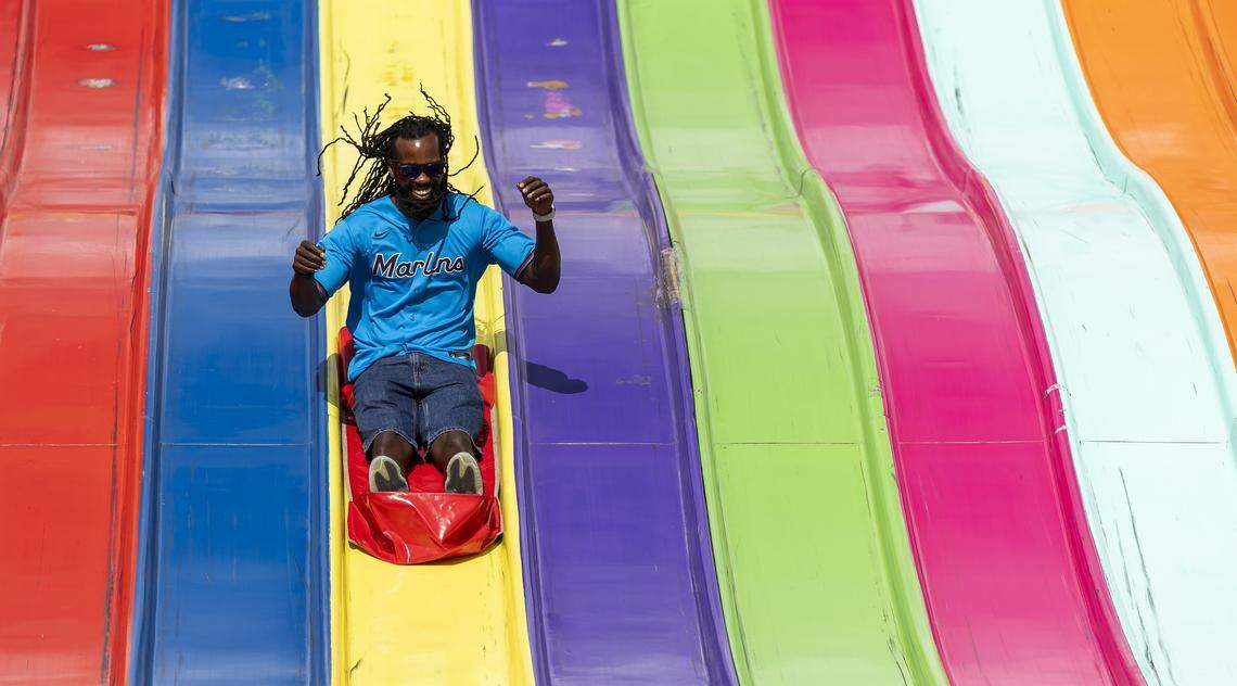 Curtis Shepard reacts as he rides down the Euro Slide attraction during the opening day of the 74th annual Miami-Dade County Youth Fair on Thursday, March 12, 2026, in Miami, Fla.