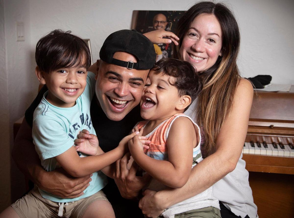 Musical artist Danny Flores, 41, at home with his wife Yaritza, 34, and sons Lucas Flores, 5, left, and Noah (Arc) Flores, 3, right, in their Coral Gables home.