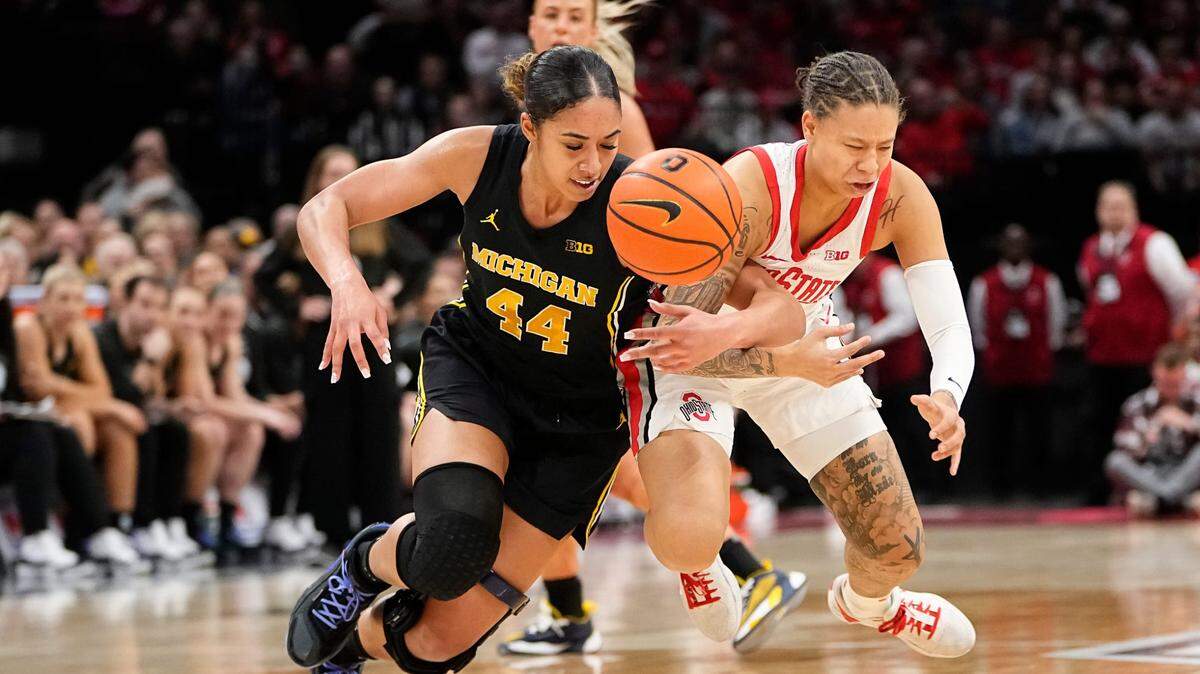 Feb 28, 2024; Columbus, OH, USA; Ohio State Buckeyes guard Rikki Harris (1) fights for a loose ball with Michigan Wolverines forward Cameron Williams (44) during the second half of the NCAA women’s basketball game at Value City Arena. Ohio State won 67-51.
