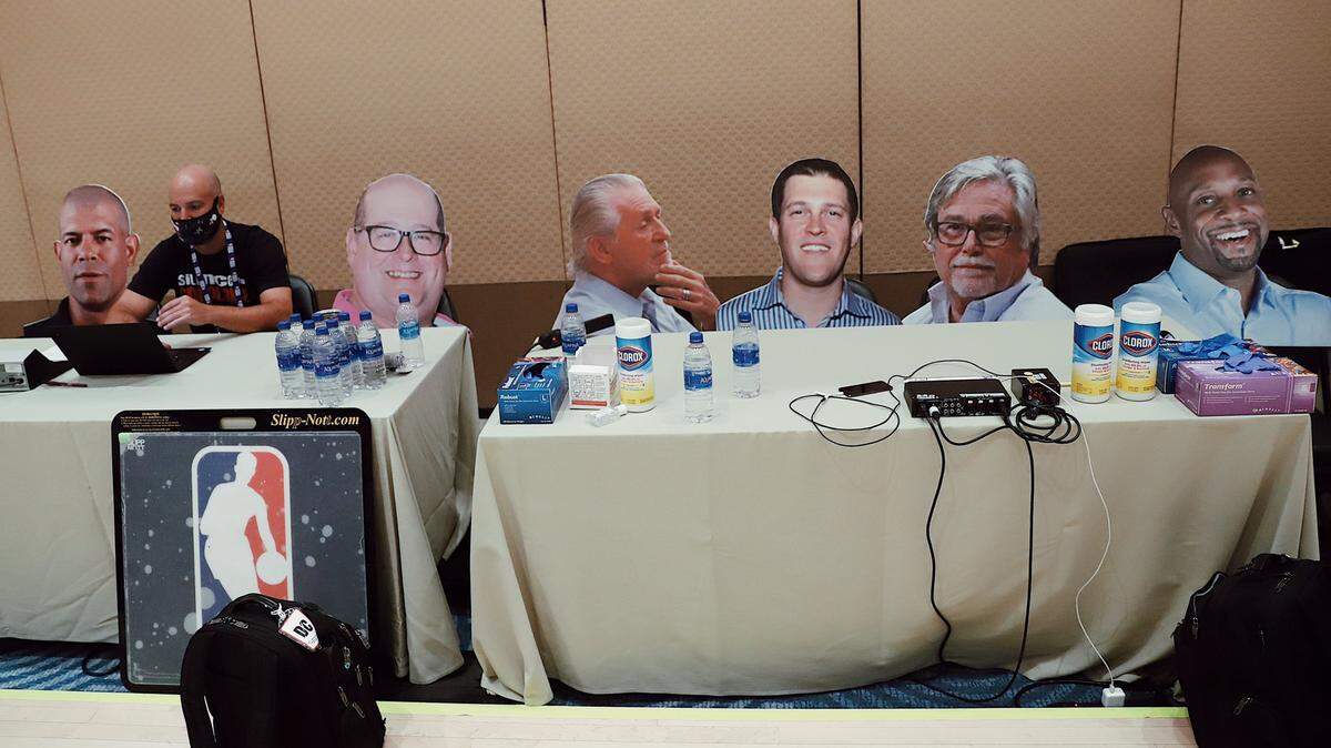 Miami Heat assistant general manager Adam Simon and the team’s front-office cardboard cutout contingent during a practice session at Walt Disney World.
