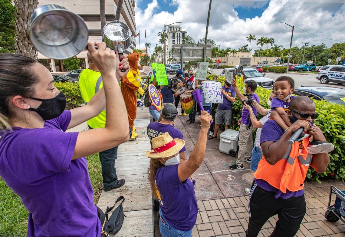 Laid-off workers from airline contractor Eulen America, hold #SOSAmericanAirlines protest in front of America Airlines building in Coral Gables on Thursday, June 25, 2020.