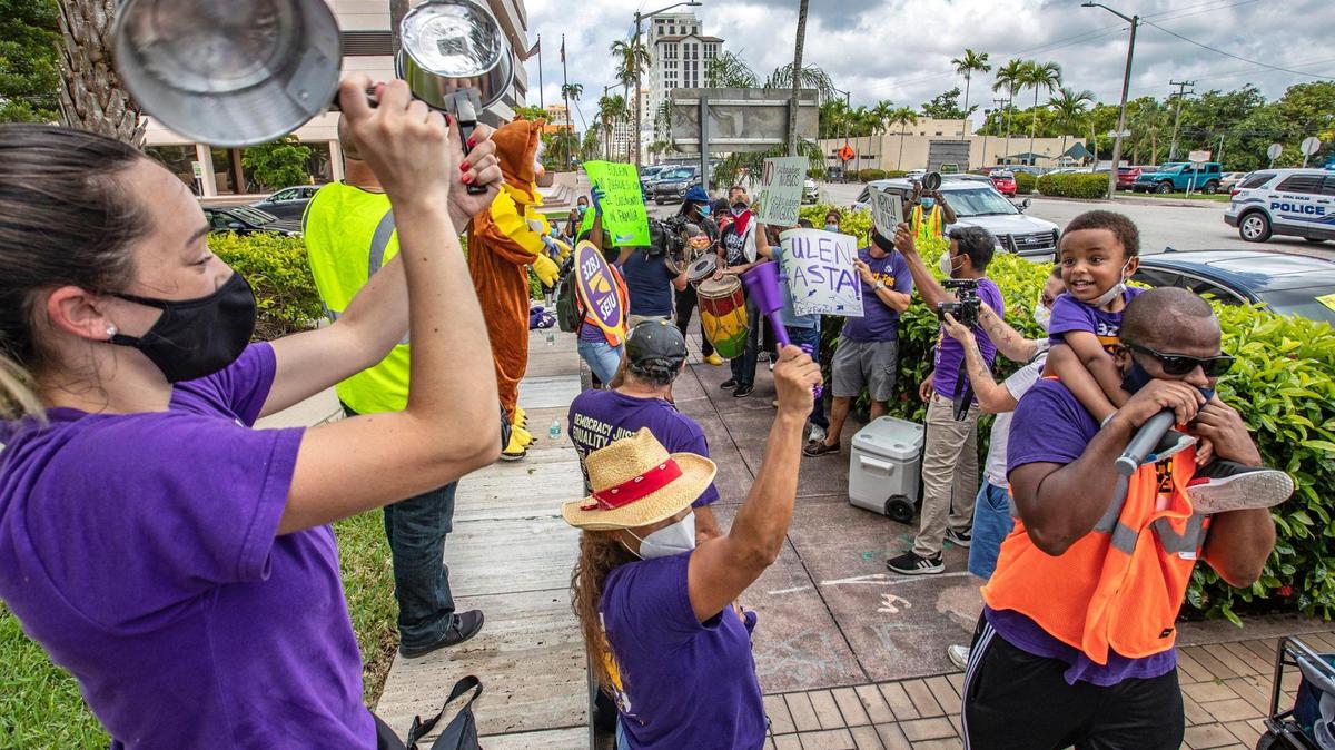 Laid-off workers from airline contractor Eulen America, hold #SOSAmericanAirlines protest in front of American Airlines building in Coral Gables on June 25, 2020.