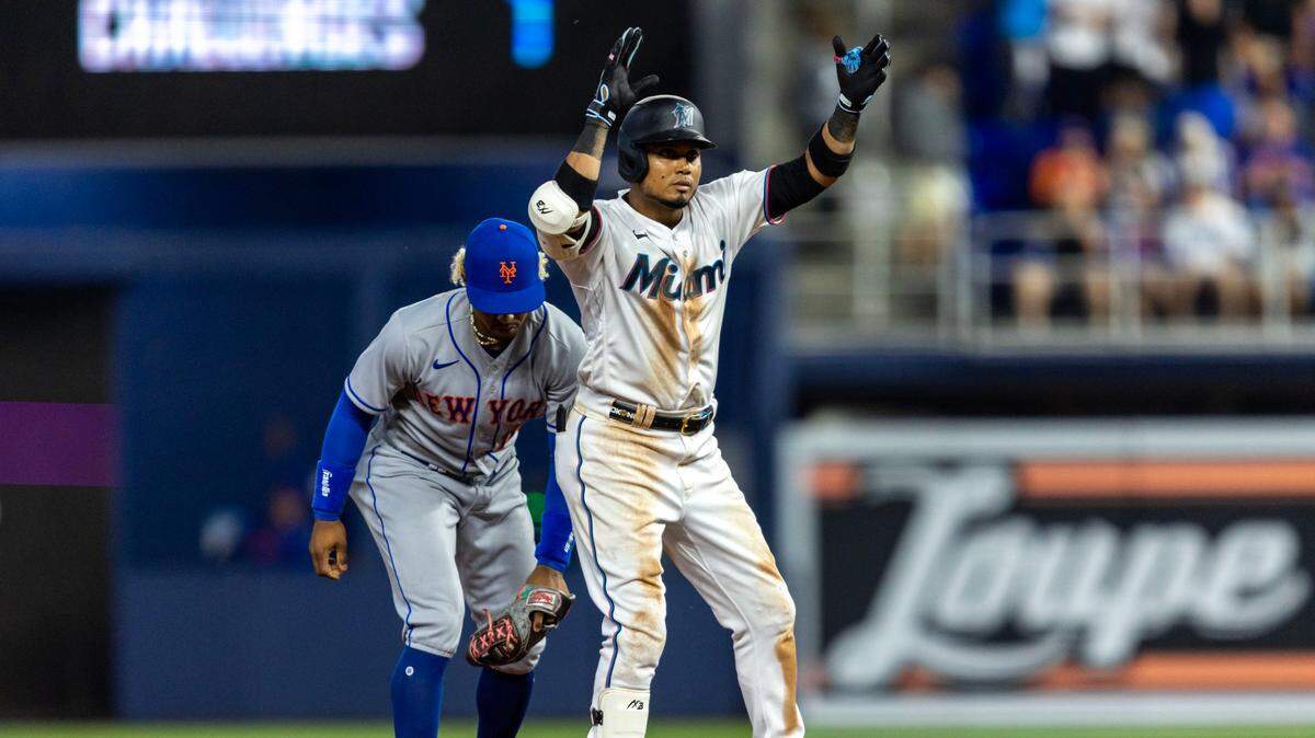 Miami Marlins base runner Luis Arraez (3) reacts to hitting a double during the sixth inning of an MLB game against the New York Mets at LoanDepot Park in Miami, Florida, on Thursday, March 30, 2023.