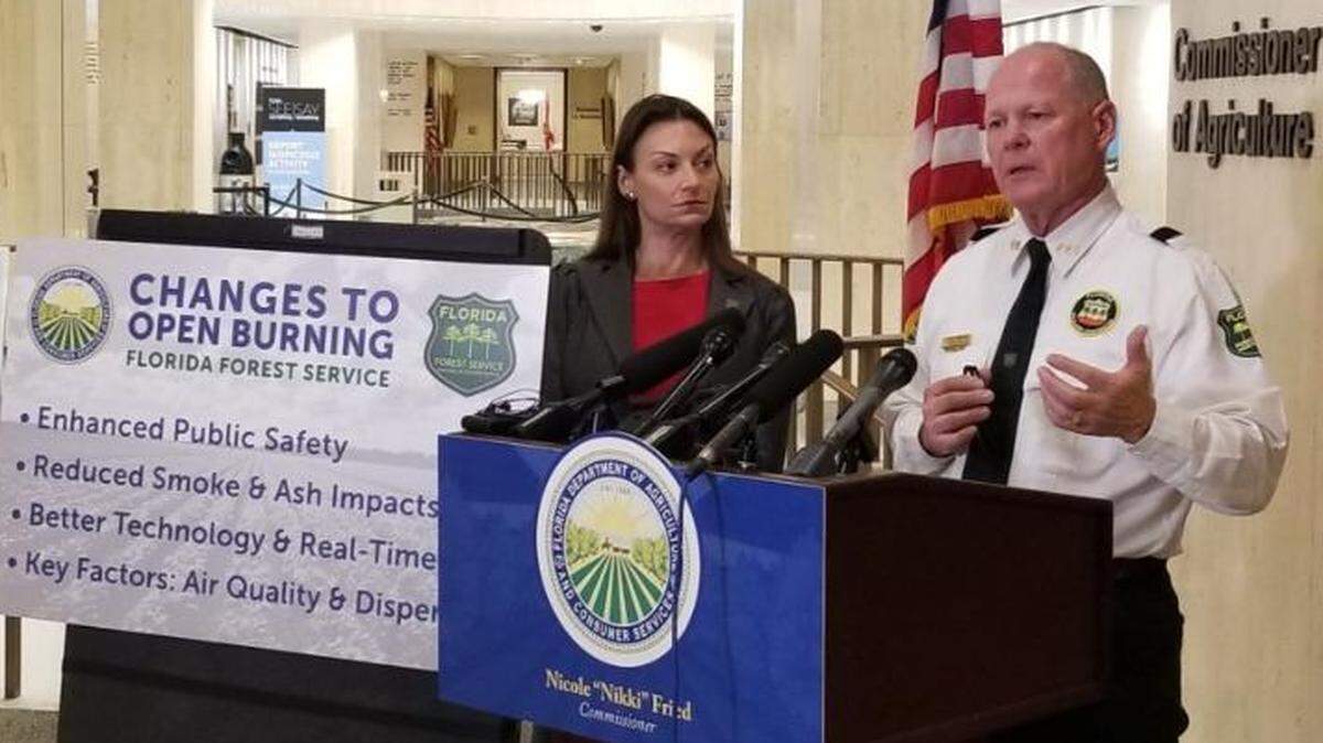 Agriculture Commissioner Nikki Fried, left, and Forest Service Director Jim Karels talk about new restrictions on sugarcane burning on Tuesday.