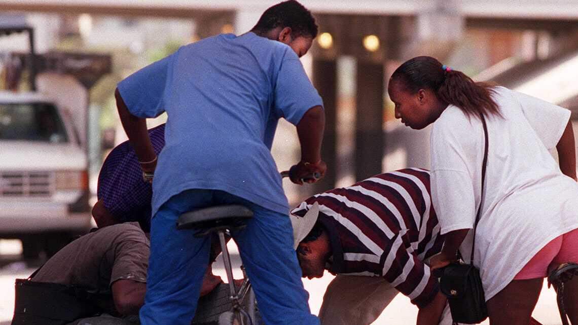 Money makes the world go around for these modern-day '49ers searching a manhole.