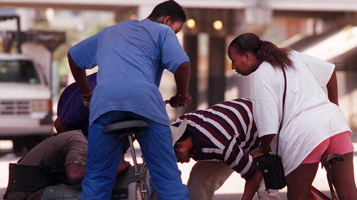 Money makes the world go around for these modern-day '49ers searching a manhole.