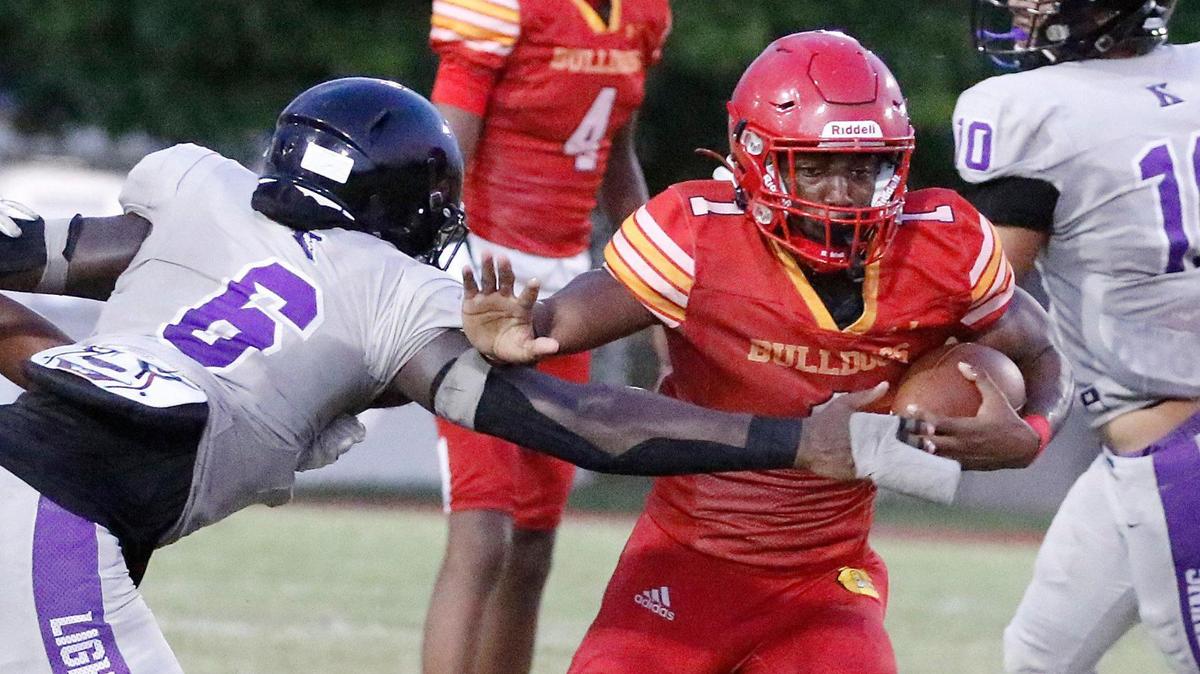 South Broward Bulldogs running back Chris Humphrey (1) evades a tackler during the football game against Dr. Krop Lightning on Friday, September 22, 2023 at South Broward HS in Hollywood. Andrew Uloza / for Miami Herald